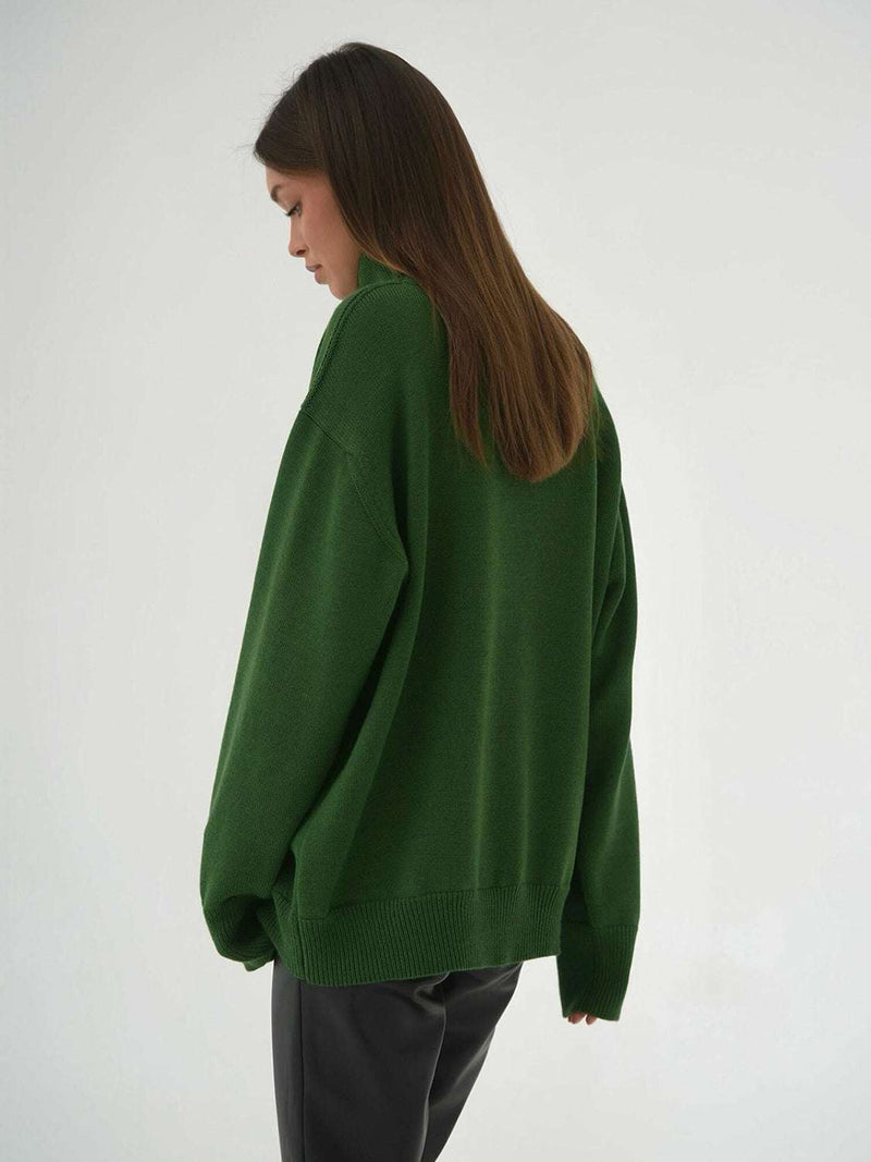 Green turtleneck long sleeve sweater made of viscose, polyester, and nylon blend.