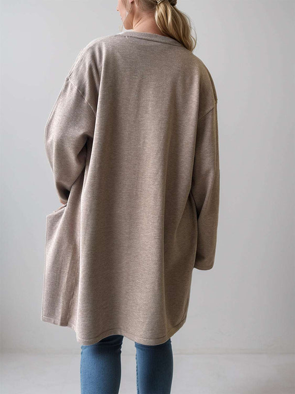 Beige open front long sleeve cardigan with pockets, shown from the back.