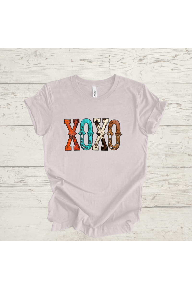XOXO Western Print Graphic Tee on a wooden surface