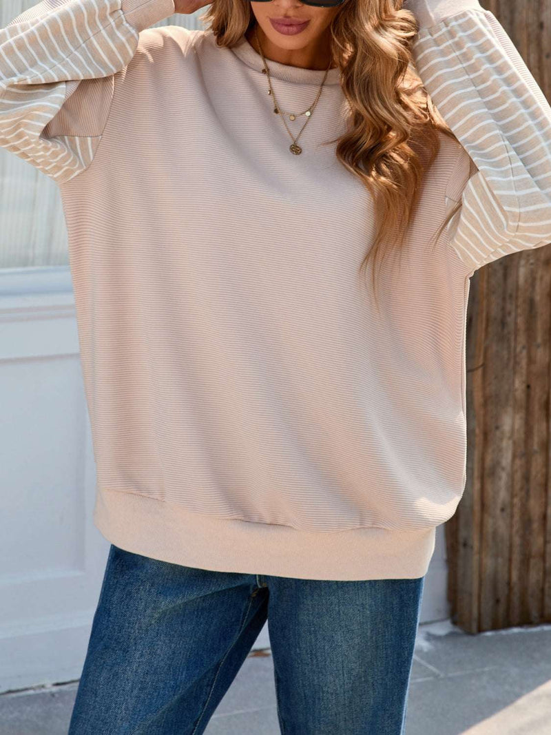 Striped patchwork long sleeve sweatshirt with a basic style and slightly stretchy fabric.