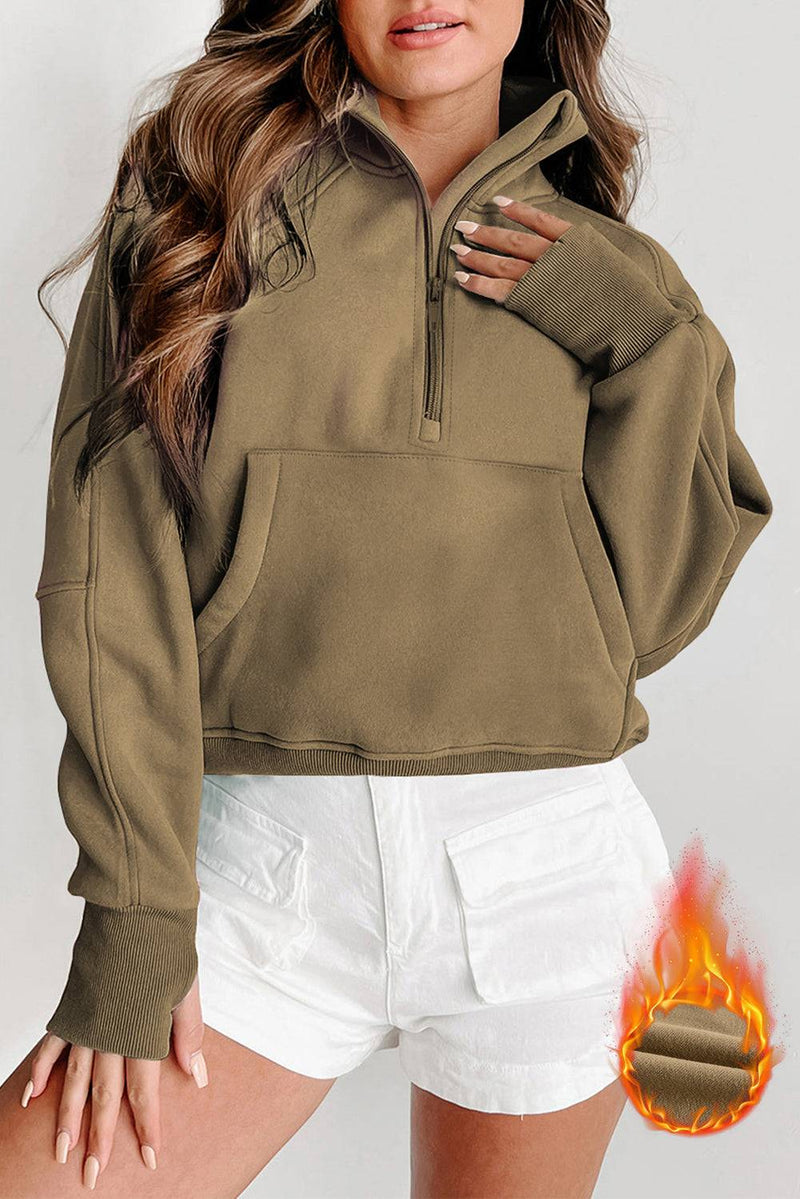 Fleece lined zip up stand collar thumbhole sleeve sweatshirt for winter warmth and style.