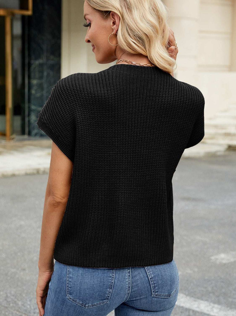 Round neck short sleeve sweater with pockets in black, slightly stretchy acrylic.