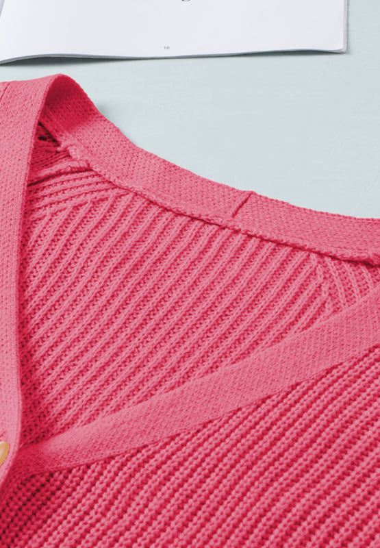 Openwork V-neck button-up pink cardigan, slightly stretchy acrylic material.