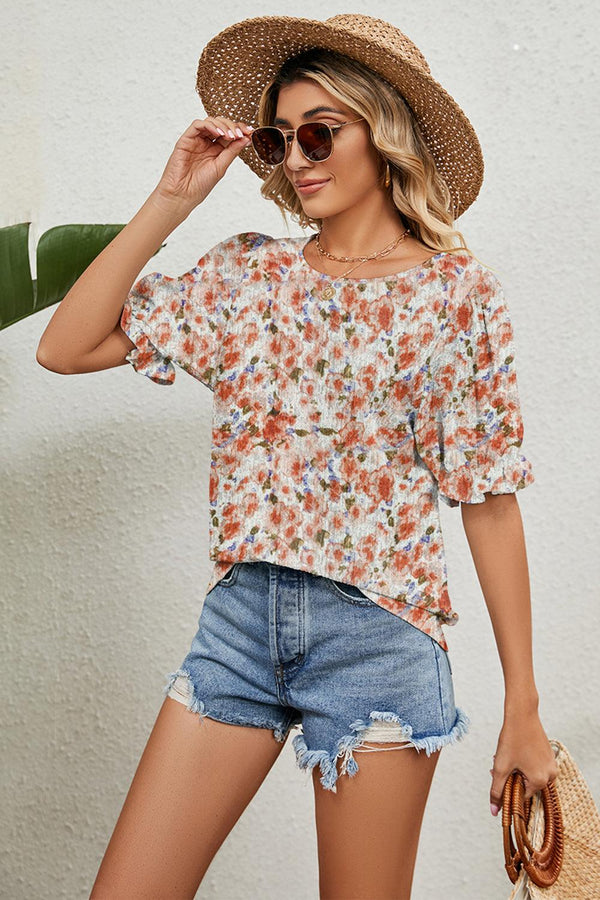 Round neck flounce sleeve blouse with floral pattern.