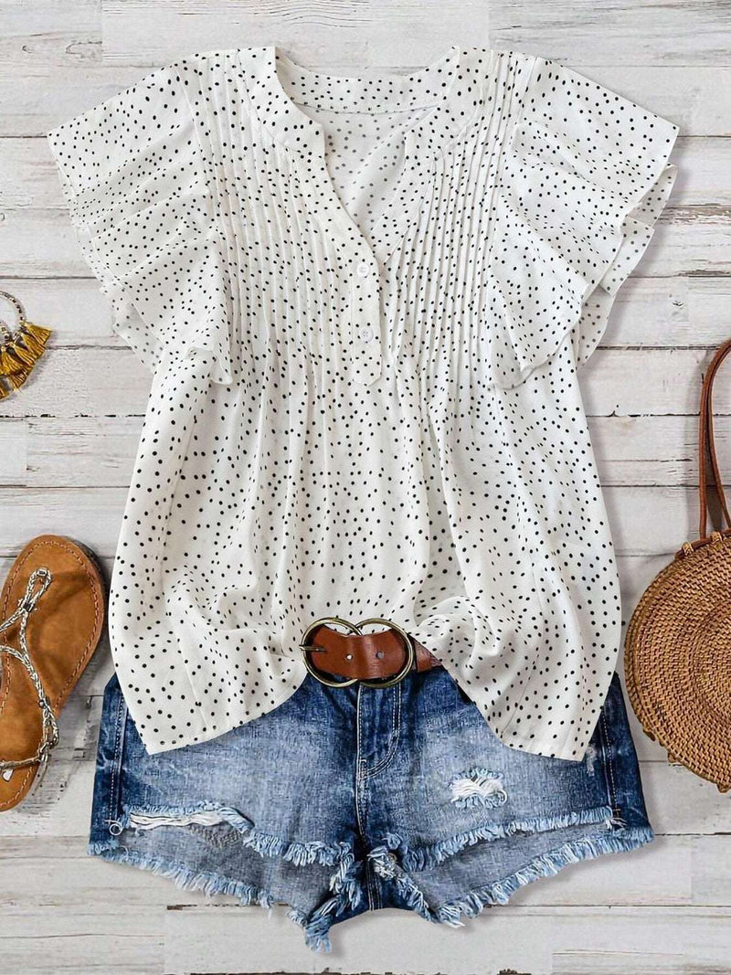 Polka Dot Blouse with Notched Ruffled Cap Sleeves styled with denim shorts.