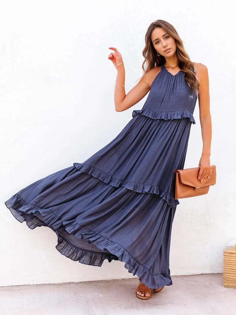 Ruffled sleeveless tiered maxi dress with pockets in navy blue.