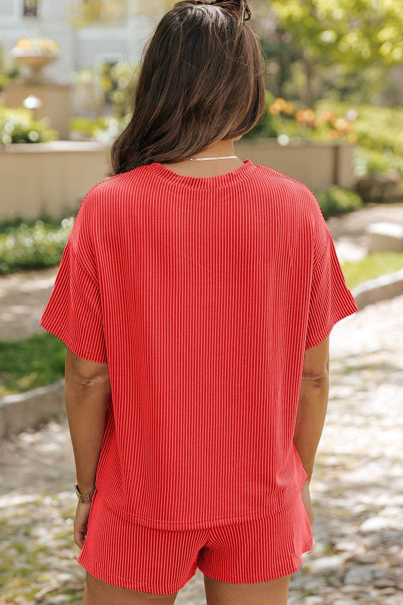 Red round neck dropped shoulder top and shorts set, slightly stretchy fabric.