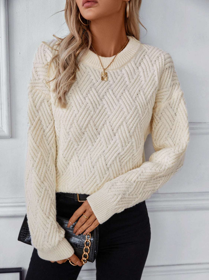 Round Neck Long Sleeve Woven Sweater in cream worn by woman with black pants and necklace.