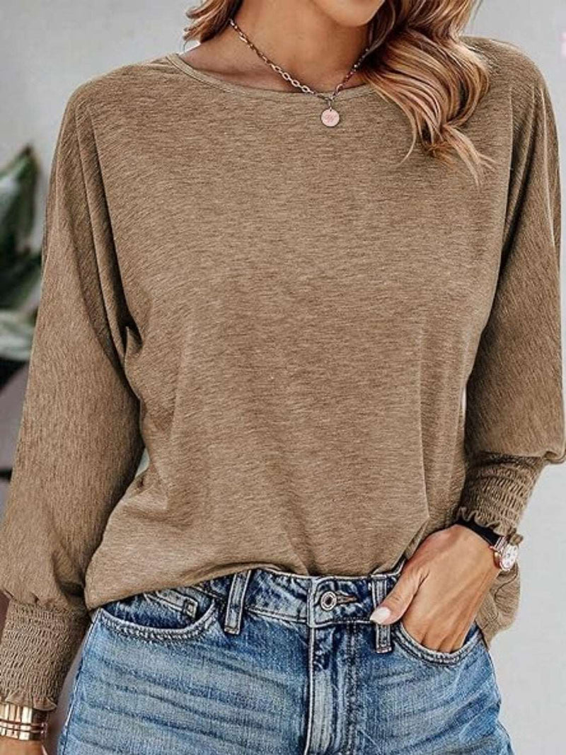 Round Neck Smocked Lantern Sleeve T-Shirt in taupe, paired with jeans.