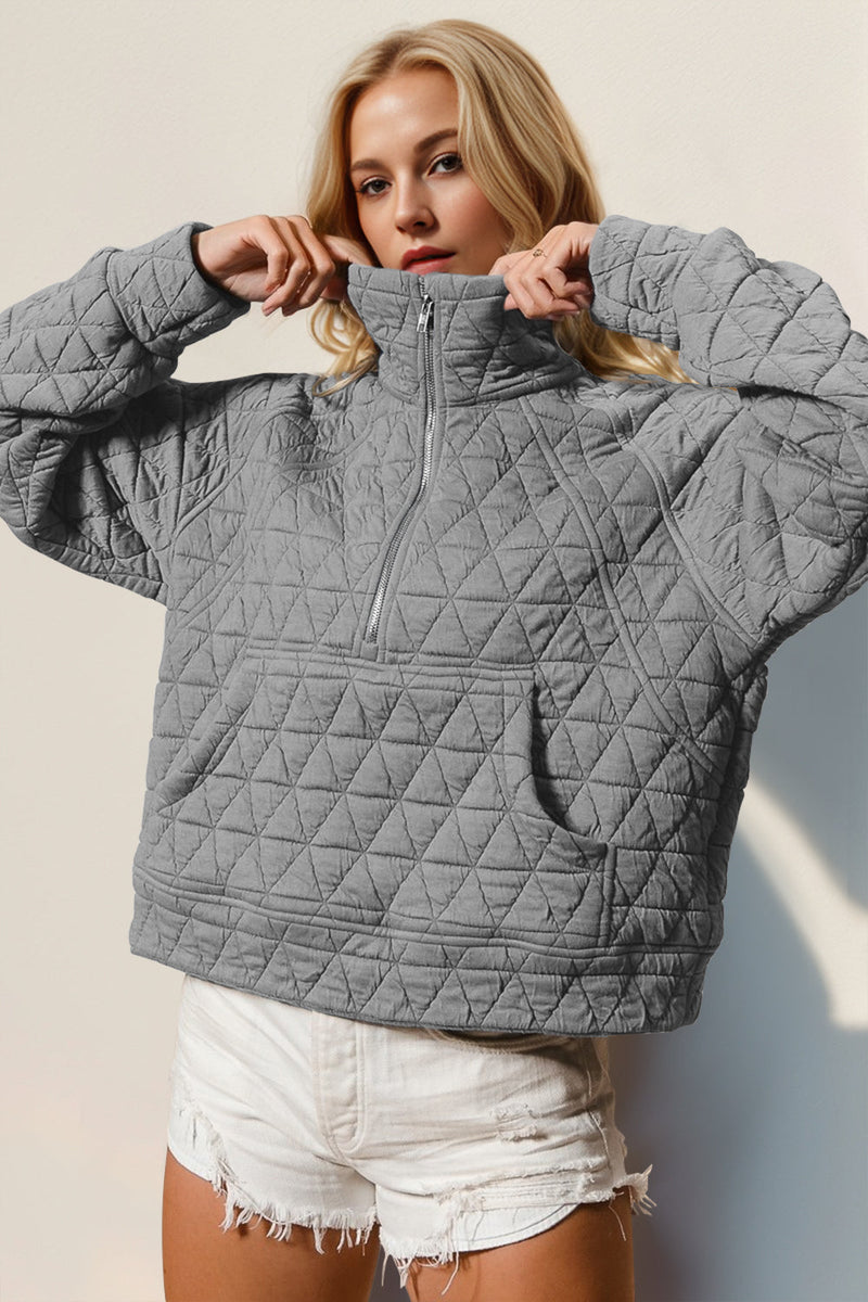 Half zip long sleeve quilted sweatshirt with pocket in gray.