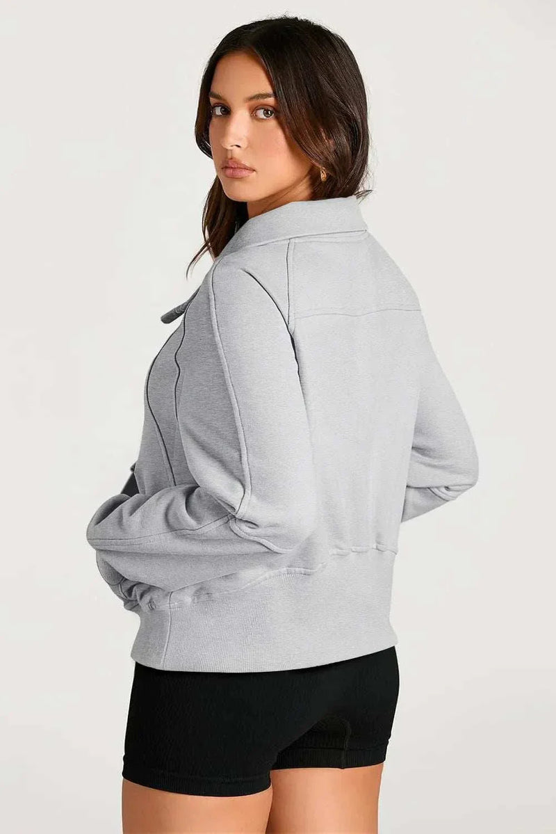 Half Zip Long Sleeve Sweatshirt in gray, cozy fabric, perfect for cooler weather and versatile styling.