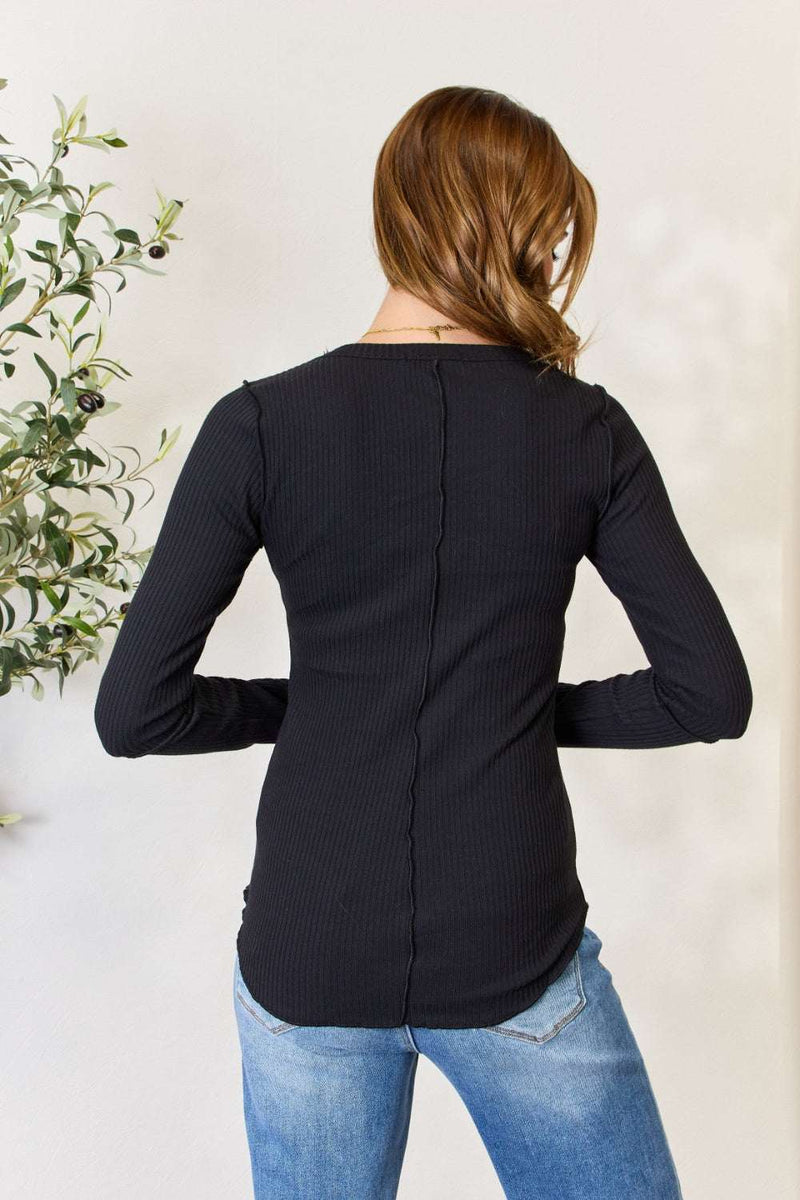 Culture Code black ribbed round neck long sleeve top, rear view, worn with jeans.