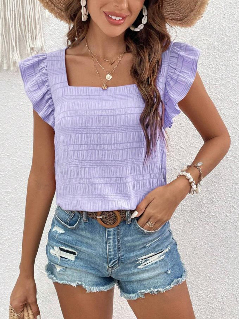 Ruffled square neck cap sleeve blouse in light purple, paired with denim shorts.