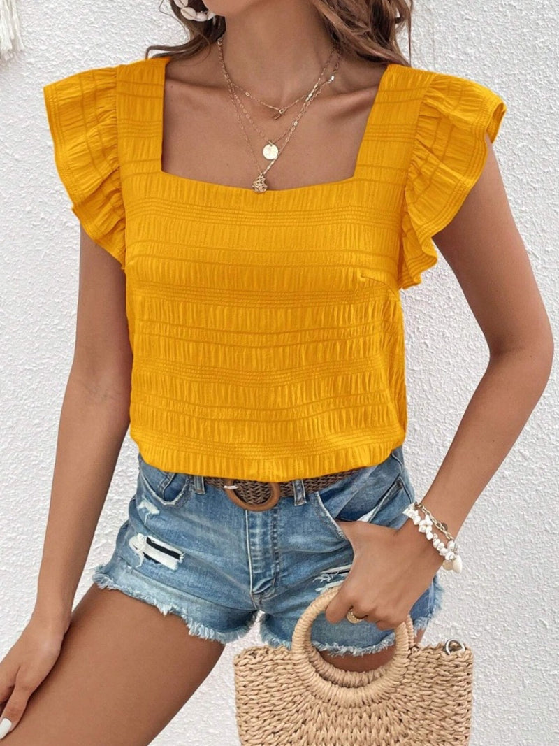 Ruffled square neck cap sleeve blouse in yellow with textured design.