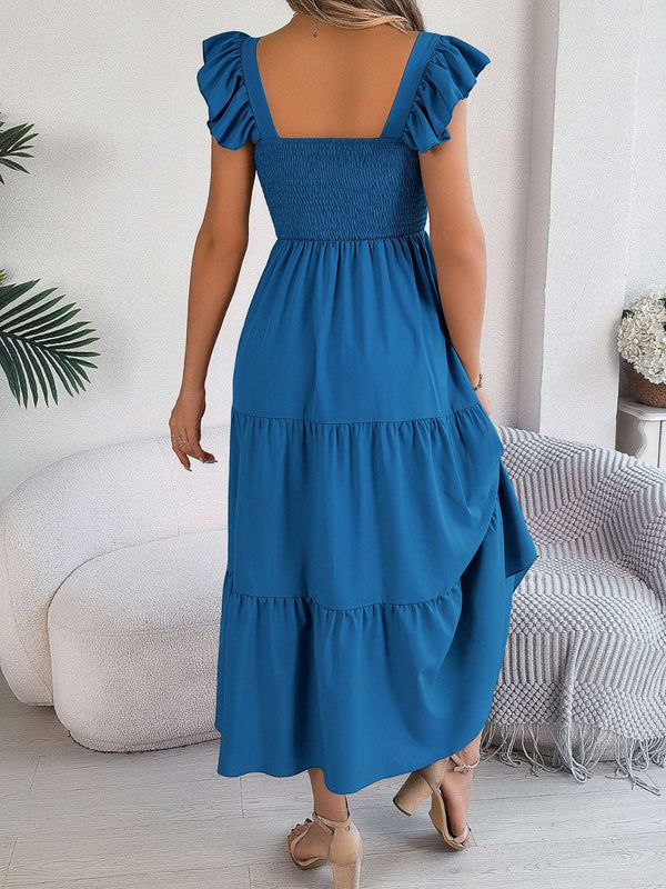 Smocked square neck cap sleeve midi dress in blue, featuring tiered design and smocked bodice.