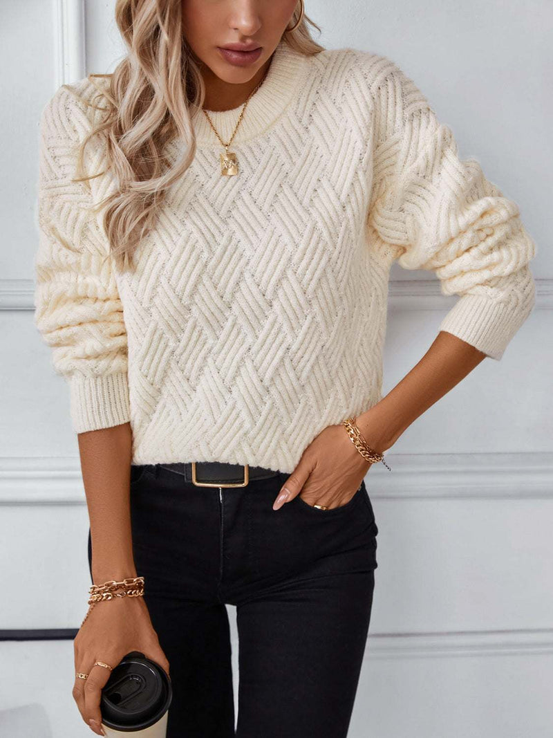 Round neck long sleeve woven sweater in off-white with diamond pattern design.