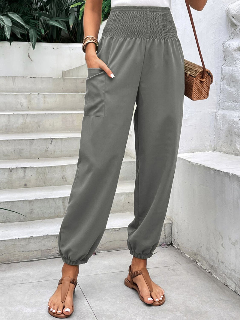 Smocked High Rise Joggers with Pockets in olive green color, featuring a comfortable fit and sleek design.