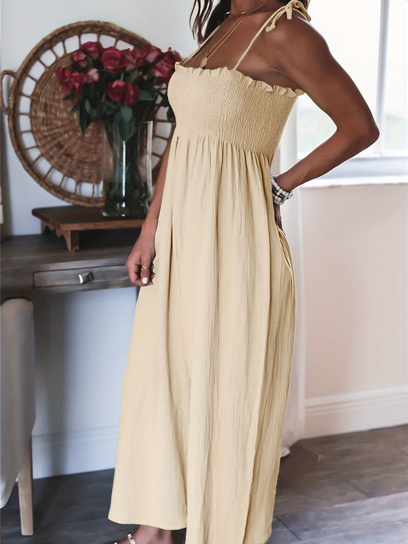 Full Size Smocked Spaghetti Strap Wide Leg Jumpsuit in a light fabric, featuring a basic style design.