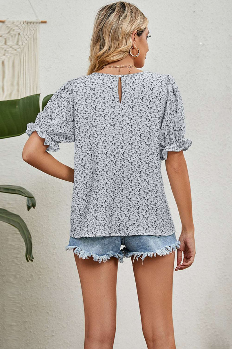 Round neck flounce sleeve blouse, patterned design, back view.