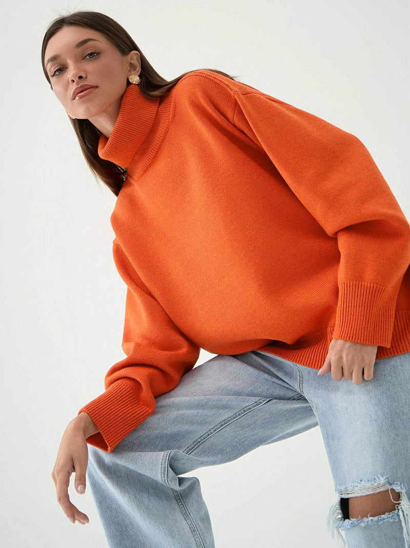 Orange turtleneck long sleeve sweater, slightly stretchy, paired with jeans.