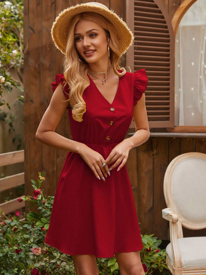 Ruffled V-Neck Cap Sleeve Mini Dress in red with button details, worn by woman outdoors.