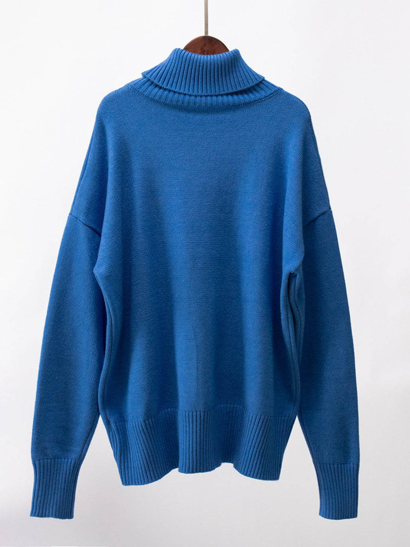 Blue turtleneck long sleeve sweater with slightly stretchy material.