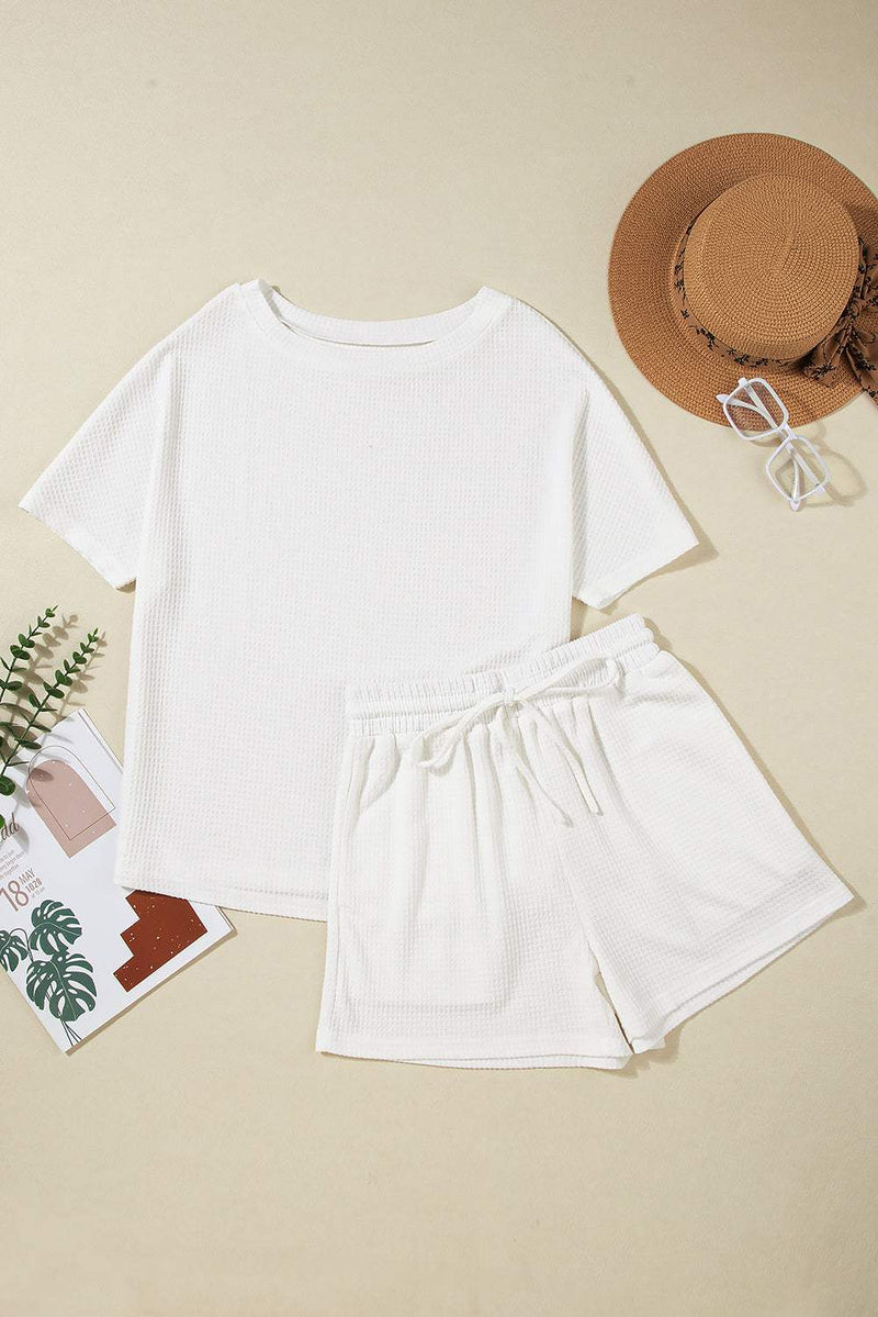 Round Neck Short Sleeve Top and Drawstring Shorts SetFeatures: Drawstring
Number of pieces: Two-piece
Stretch: Slightly stretchy
Material composition: 75% polyester, 25% viscose
Care instructions: Machine wash cold. TuAll TopsTrendsiKlondike Creek Unique BoutiqueRound Neck Short Sleeve Top