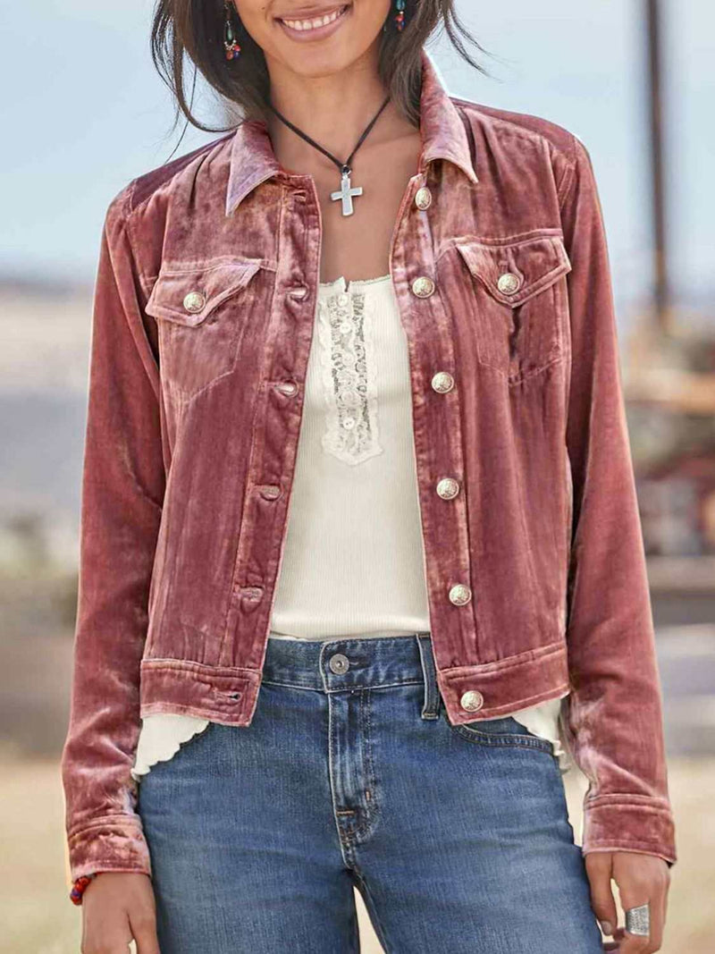 Button up jacket with chest pockets, long sleeves, in a casual outdoor setting.