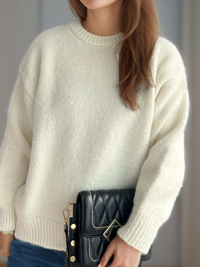 Round neck long sleeve sweater in soft fabric, perfect for chilly days.