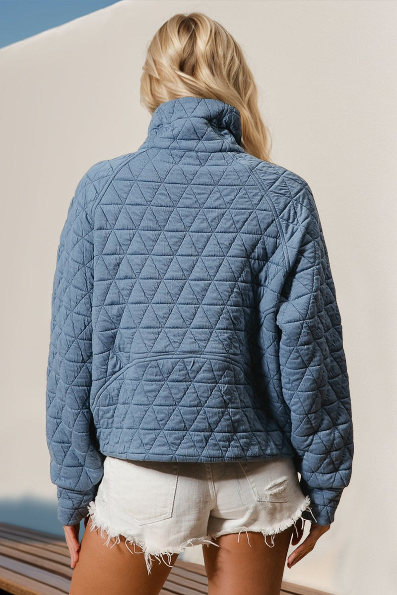 Half zip long sleeve quilted sweatshirt with pocket, blue, back view.