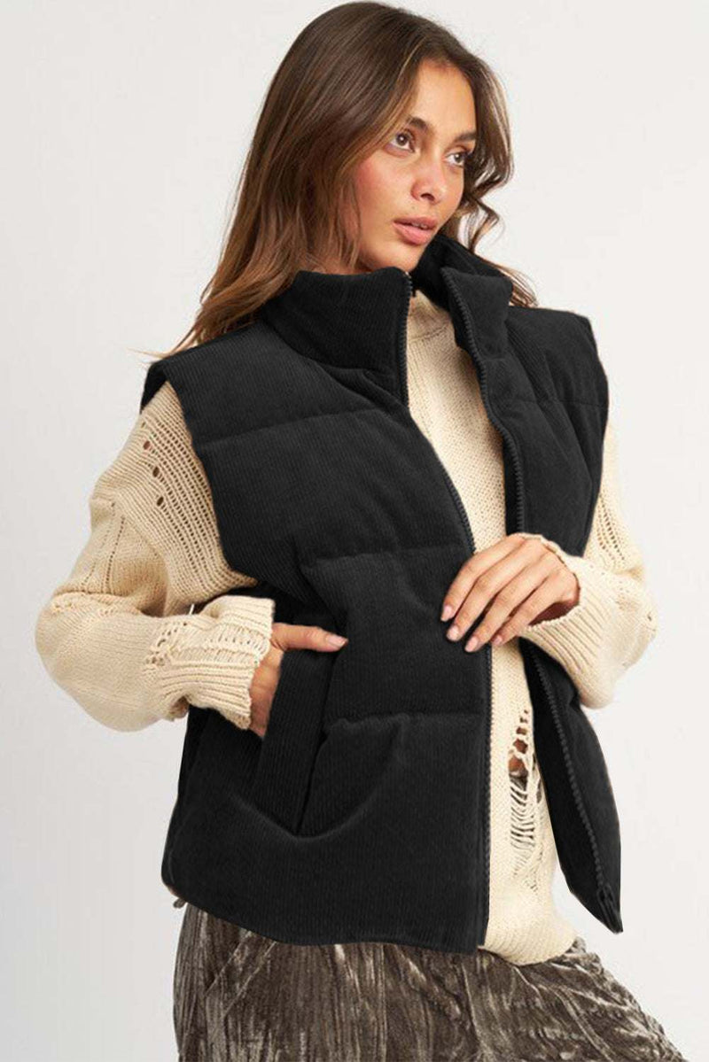 Coffee Corduroy Stand Neck Zipped Puffer Vest on female model, showcasing fashionable winter wear.