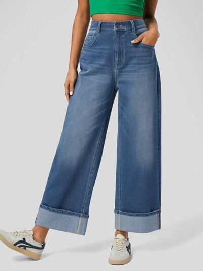 High rise rolled straight leg jeans with buttoned pockets, slightly stretchy denim.