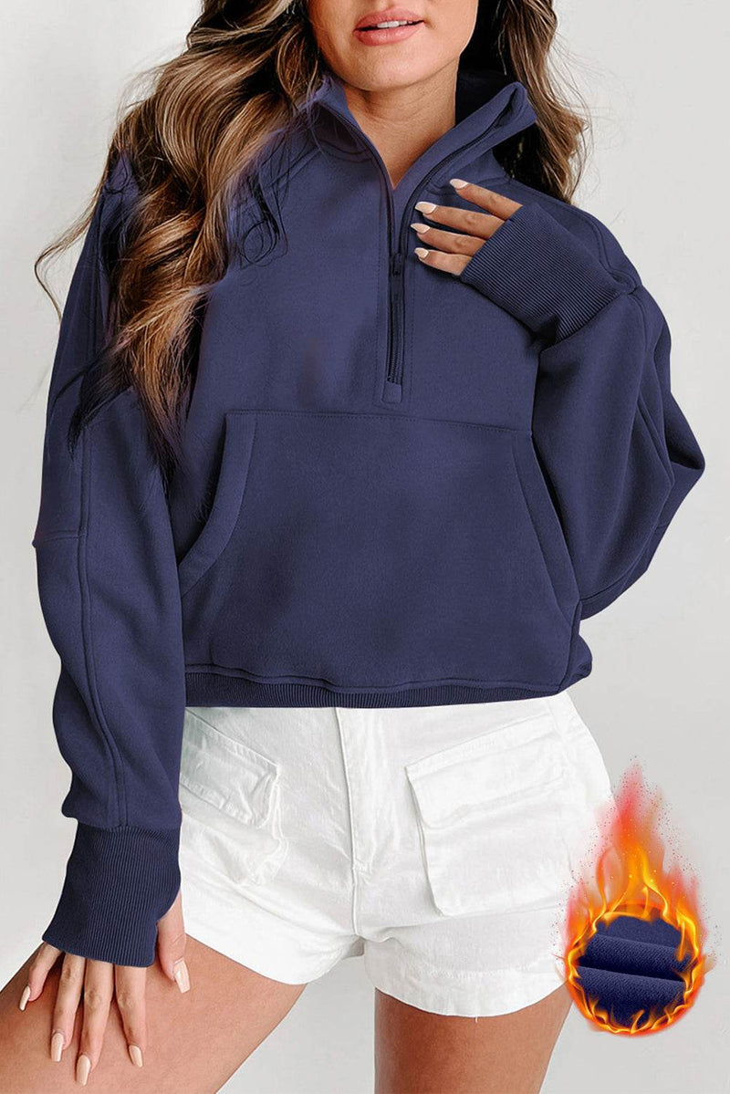 Fleece lined zip up sweatshirt with stand collar and thumbhole sleeves.