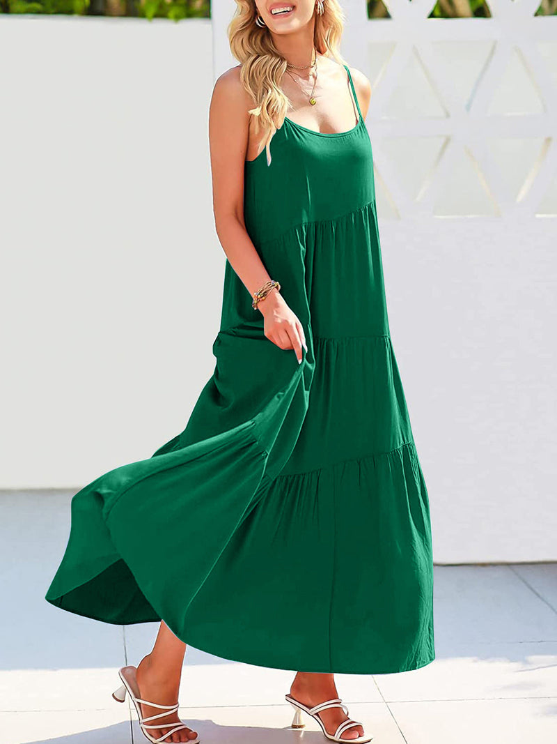 Full Size Ruched Tiered Spaghetti Strap Dress in green, flowing design, worn by model.