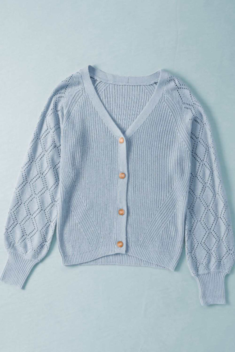Openwork V-neck button-up cardigan in light blue with buttoned front and slightly stretchy acrylic material.