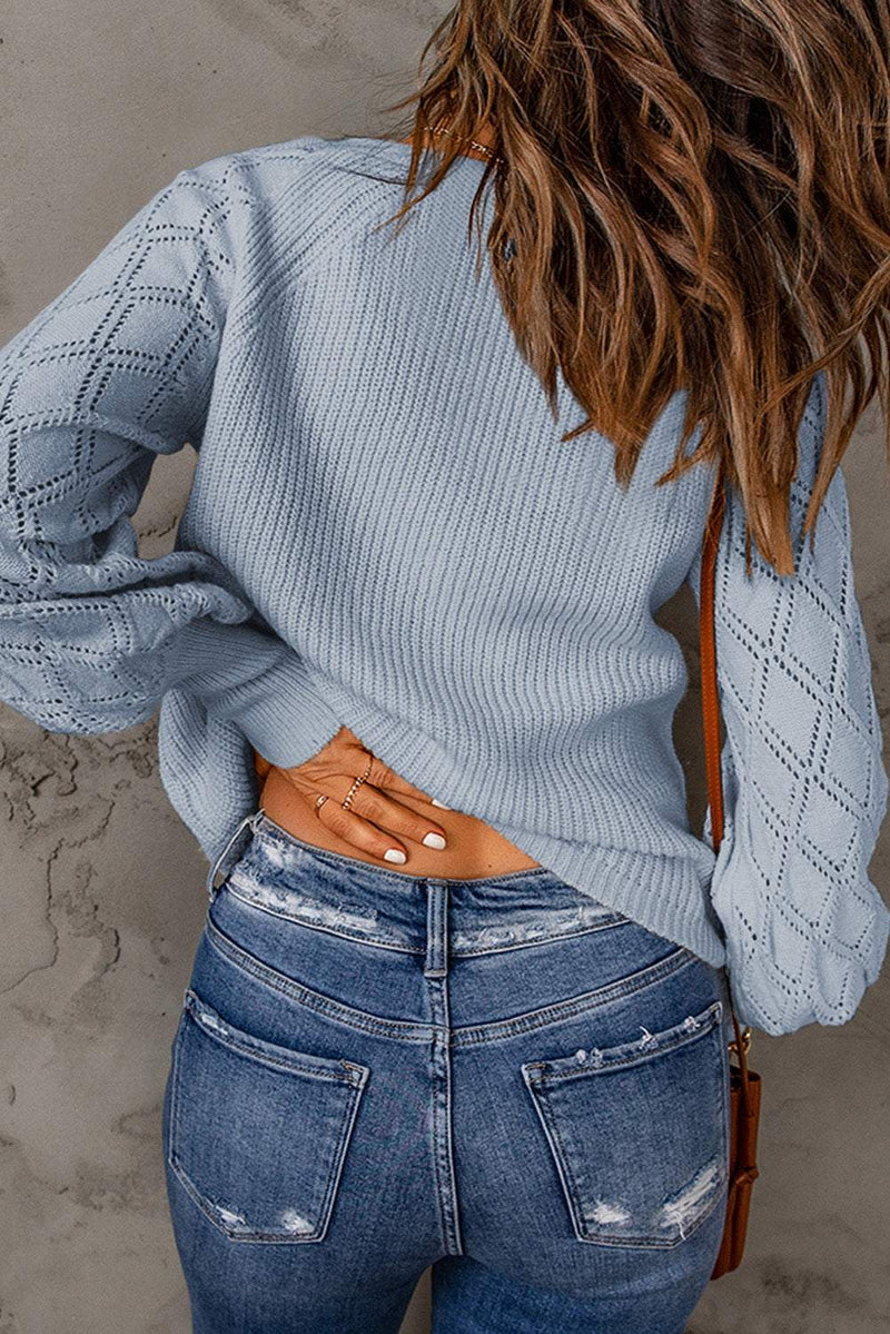 Openwork V-neck button-up cardigan in light blue with slightly stretchy acrylic material.