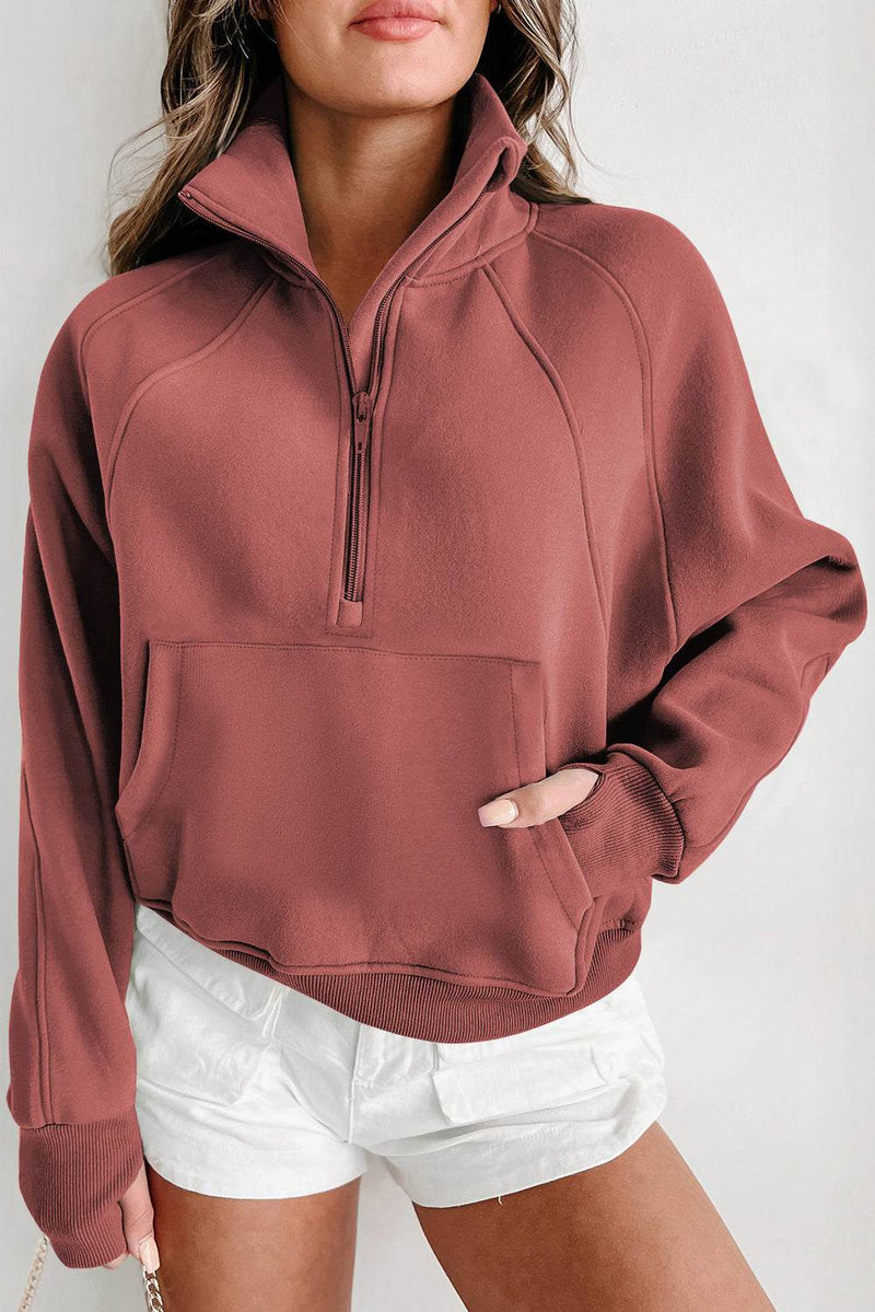 Fleece lined zip up stand collar sweatshirt with thumbhole sleeves.