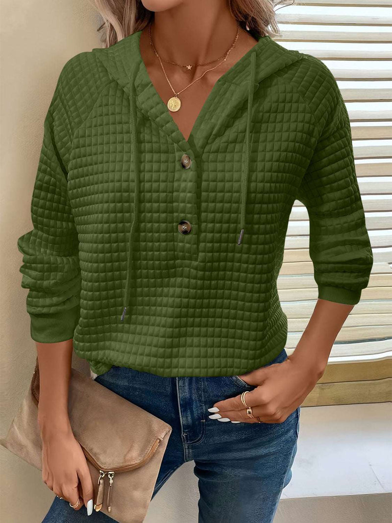 Full Size Texture Button Detail Drawstring Long Sleeve Hoodie in green, worn by model with jeans.