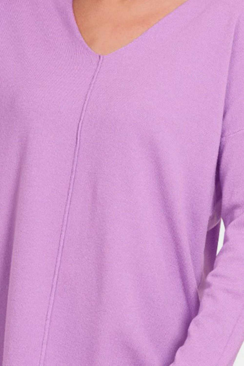 Lavender V-neck dropped shoulder sweater with slit detail.