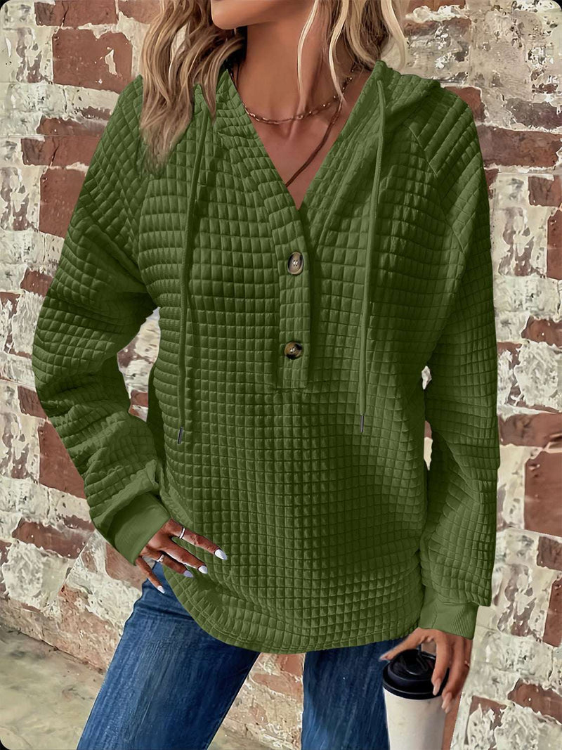 Full size textured hoodie with button detail and drawstring long sleeves in green.
