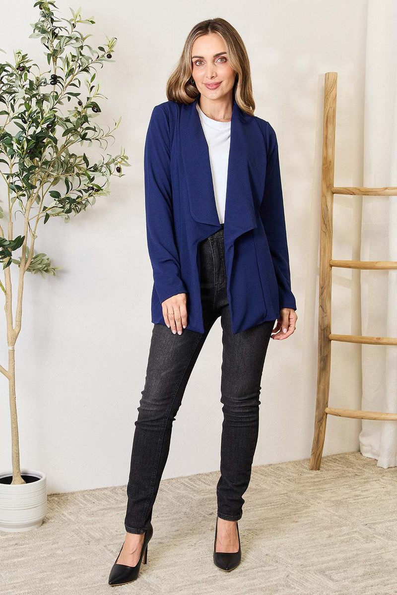 Heimish Full Size Statement Neck Open Front Blazer in navy, worn by model, showcasing unique neckline and chic design.