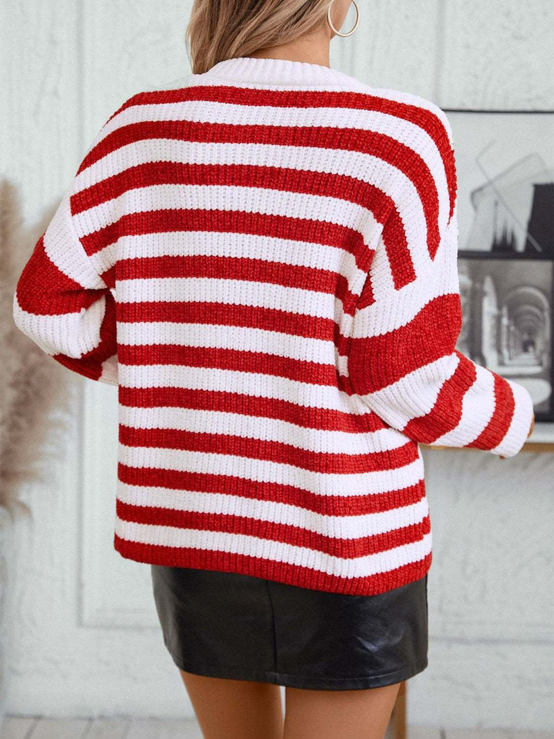 Striped round neck long sleeve sweater in red and white, worn by model.