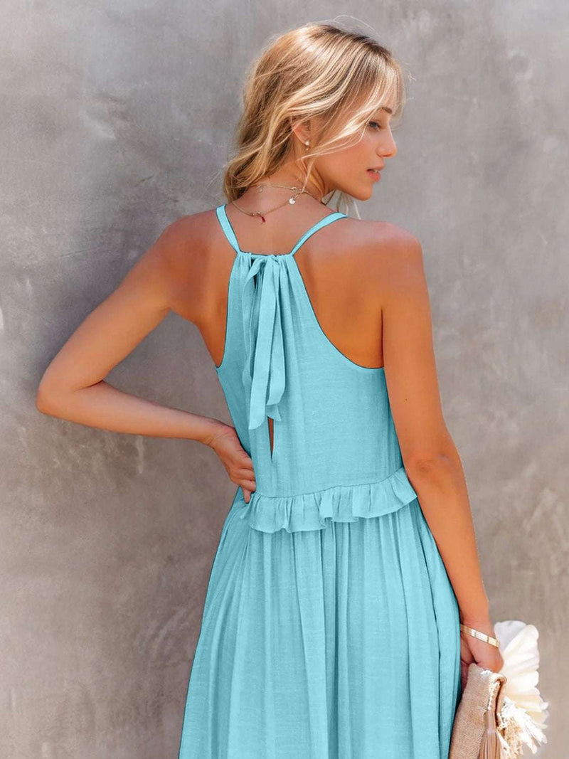Ruffled sleeveless tiered maxi dress with tied straps and pockets.