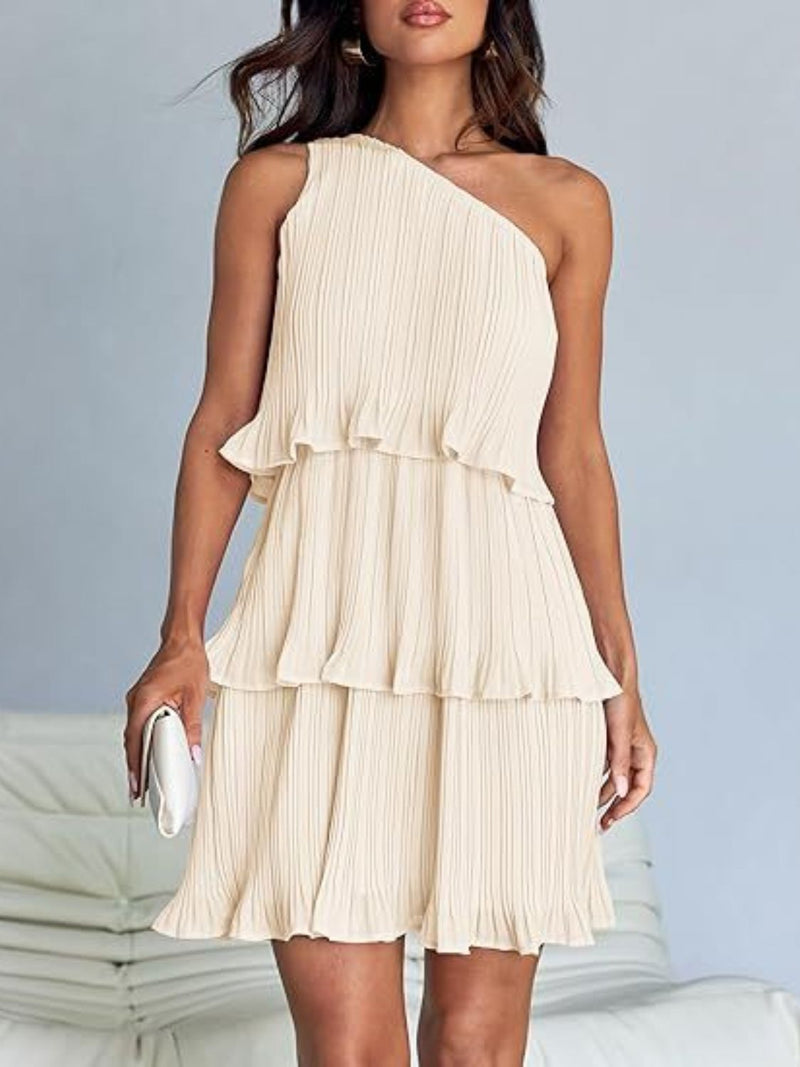 Layered single shoulder mini dress with ruffled tiers in beige.