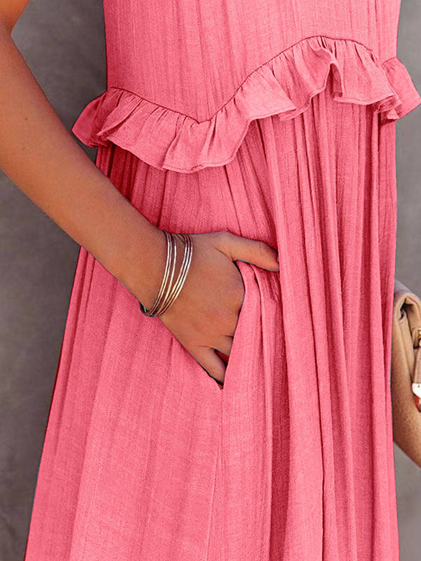 Ruffled sleeveless tiered maxi dress with pockets in pink, close-up.