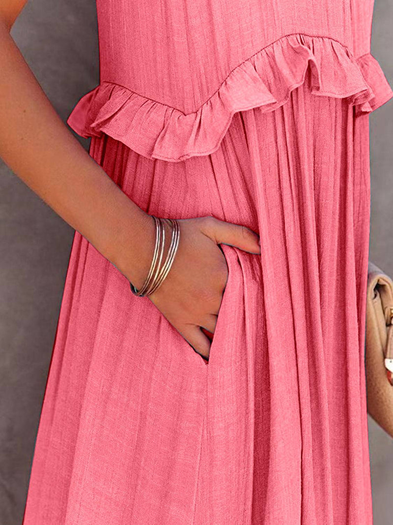 Ruffled sleeveless tiered maxi dress with pockets in pink, close-up.