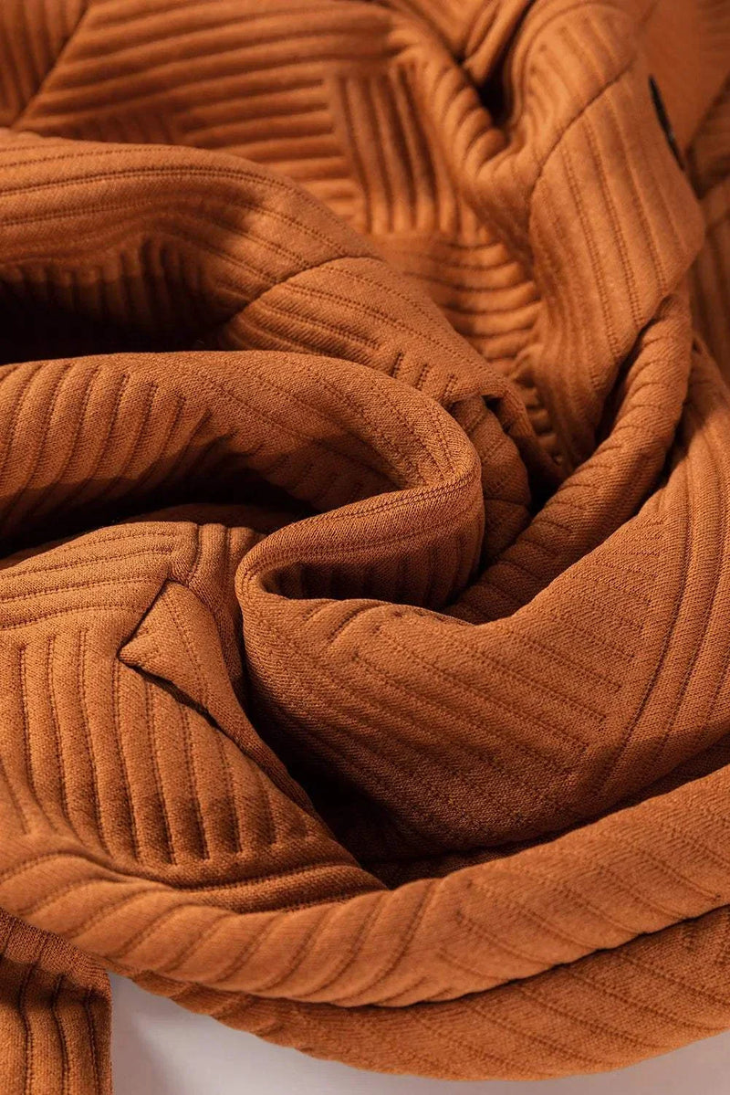 Textured button-down collared neck coat in rich brown fabric.