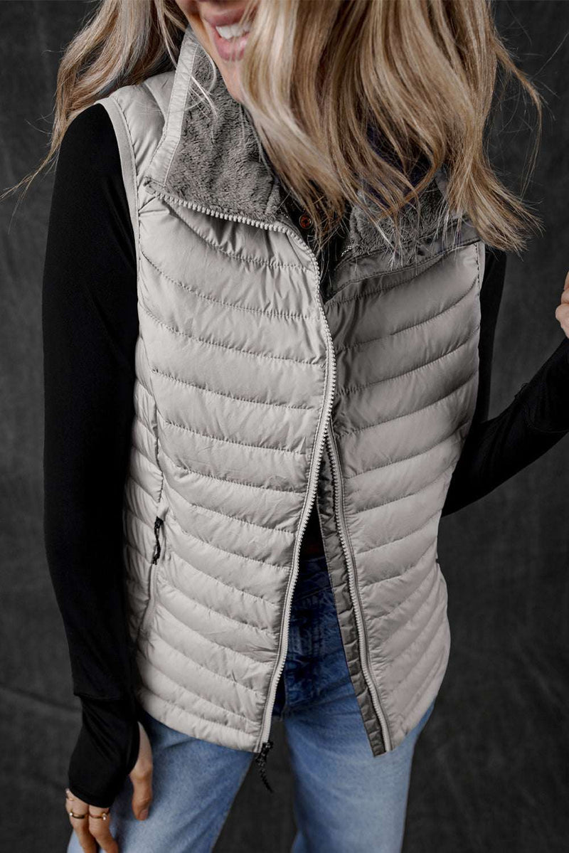 Black Plush Collared Quilted Zipped Puffer VestIntroducing our Black Plush Collared Quilted Zipped Puffer Vest - the perfect blend of comfort and chic! Designed for those who love to stay warm without compromisinOuterwear/VestsKlondike Creek Unique BoutiqueKlondike Creek Unique BoutiqueBlack Plush Collared Quilted Zipped Puffer Vest