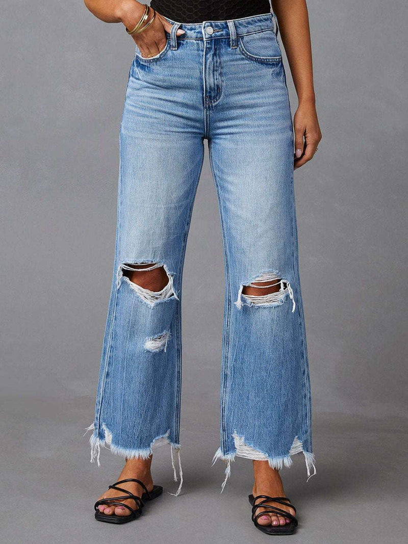 Distressed raw hem jeans with pockets, high-quality denim, edgy look, laid-back style.