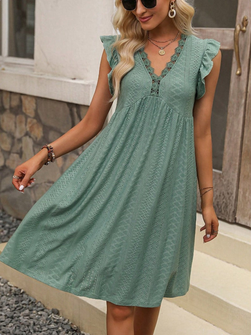 Lace detail ruffled V-neck mini dress in green.